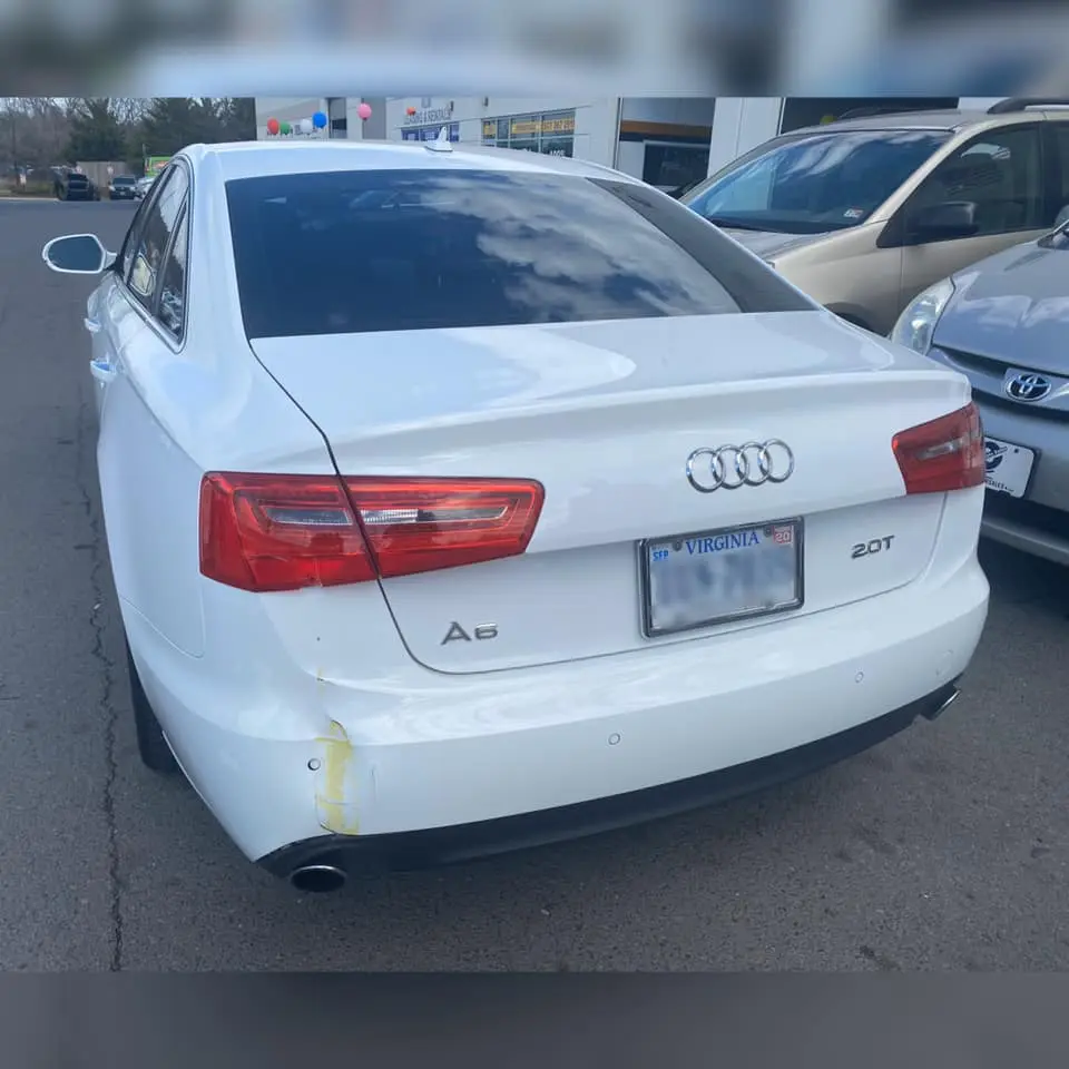 White audi with dented bumper